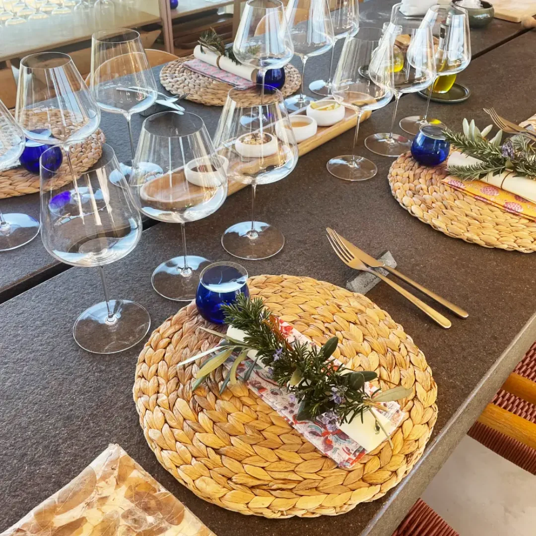 Elegant private sunset dinner setup with wine glasses