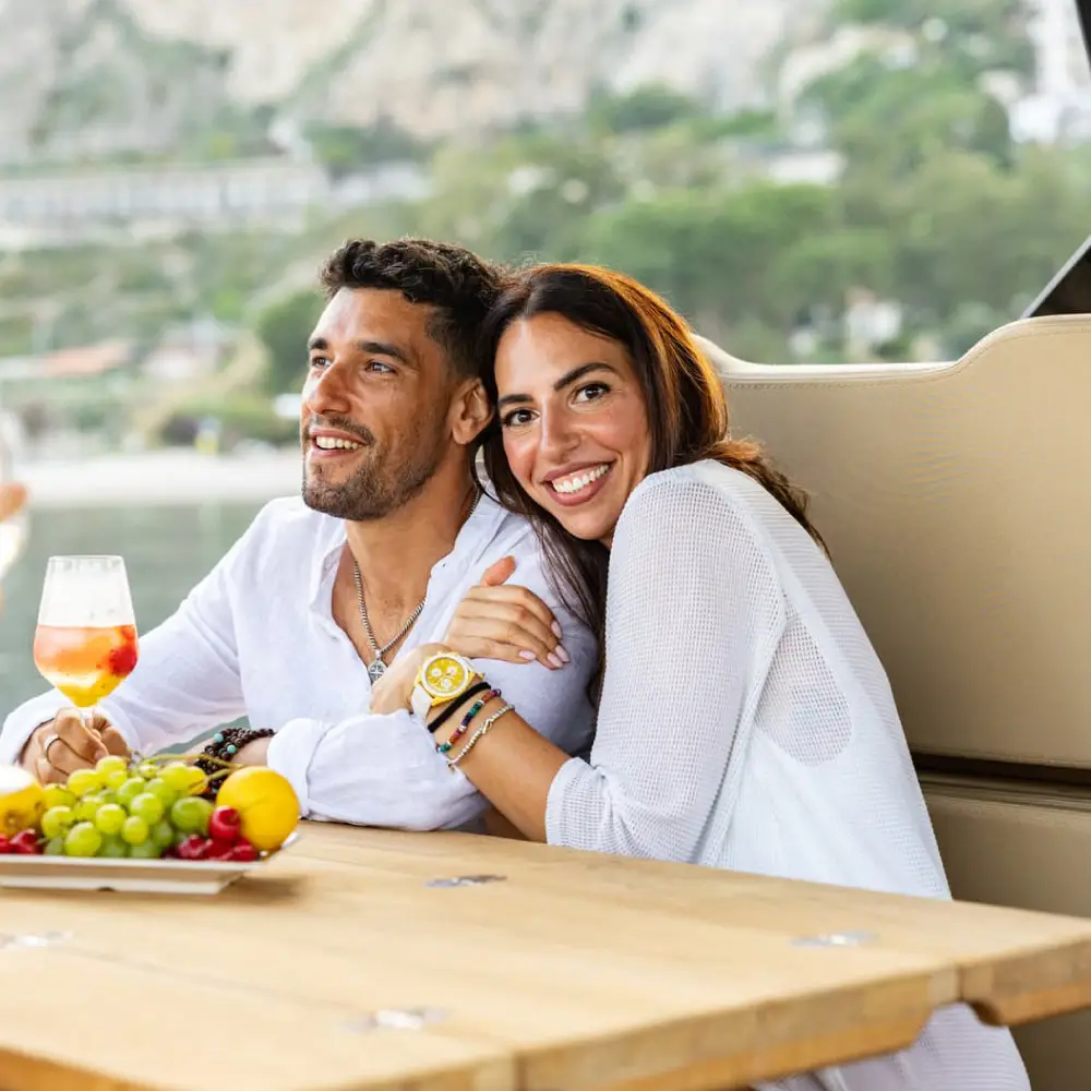 couple enjoying martini aperitivo yacht taormina sunset